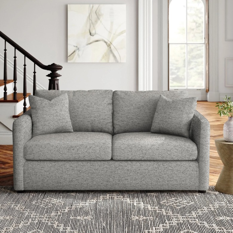 heather gray sofa in neutral living room
