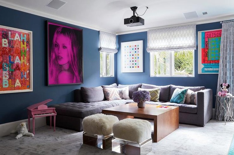 at home theater with sectional and navy walls