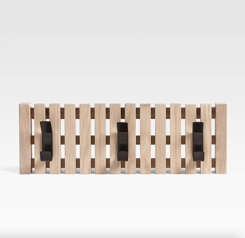 White oak pallet coat rack with matte black hooks.