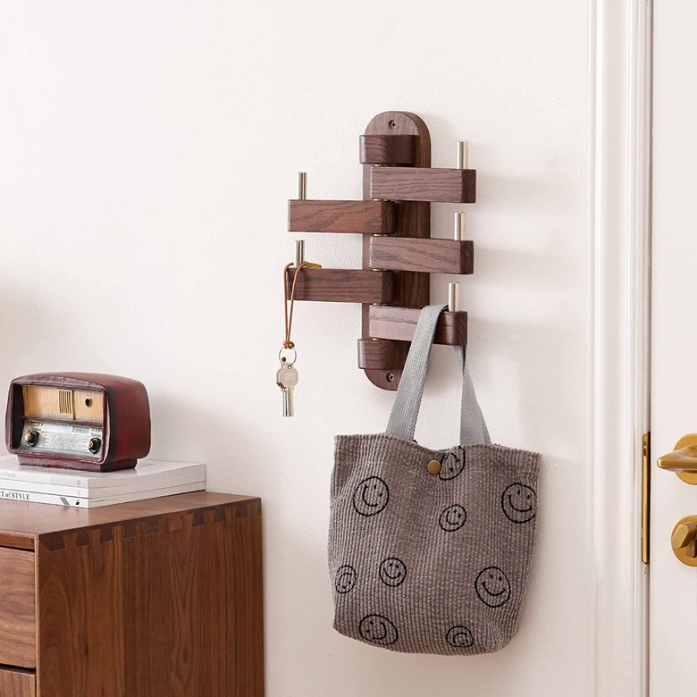 wooden coat rack that swings out