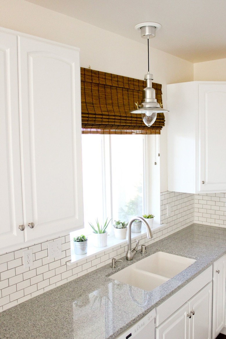 white granite countertop with white subway tile backsplash