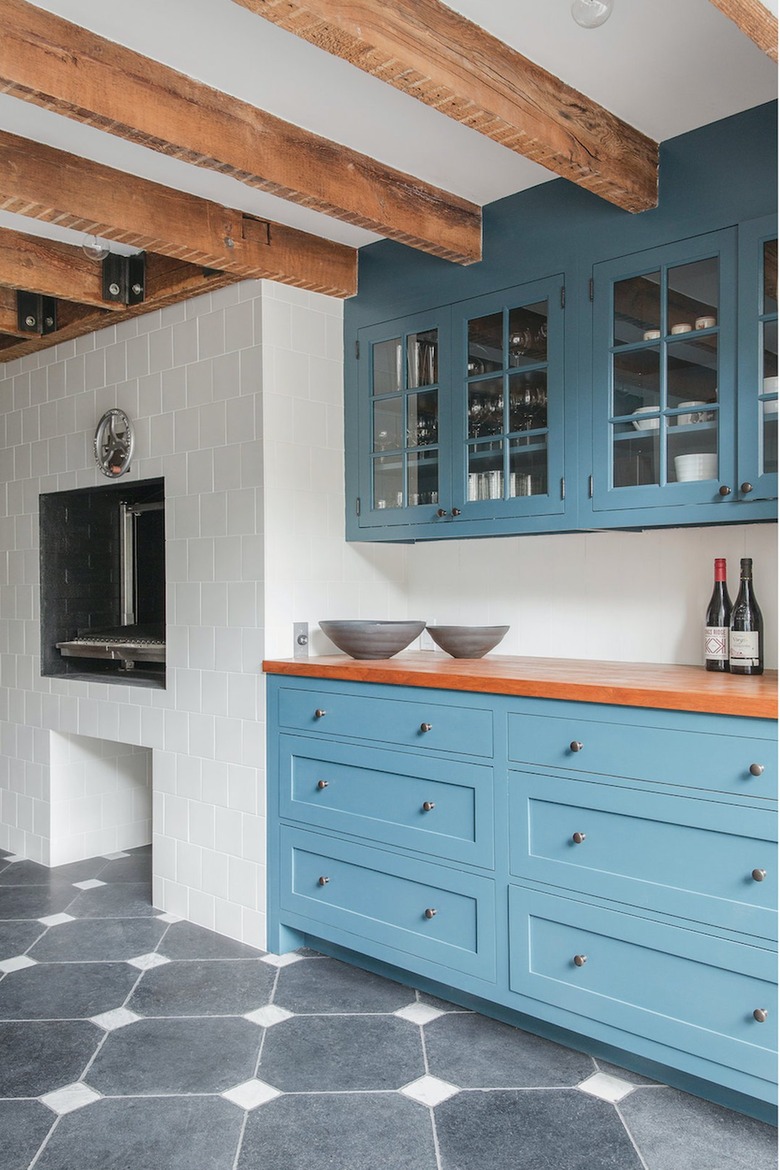 robin's egg blue kitchen with black and white tile