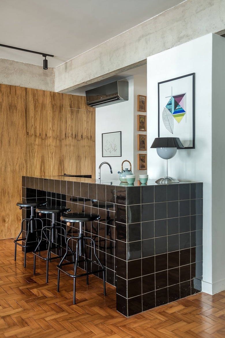 black tiled kitchen island with barstools