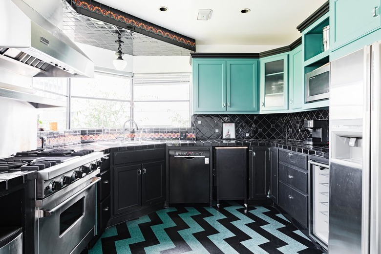 Black Room Ideas with bold kitchen with turquoise-black flooring and cabinets