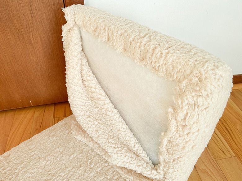 Cut off the excess shearling blanket fabric with scissors.
