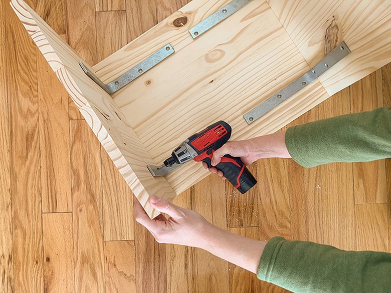 Add strength to the stool form using heavy-duty L-brackets.