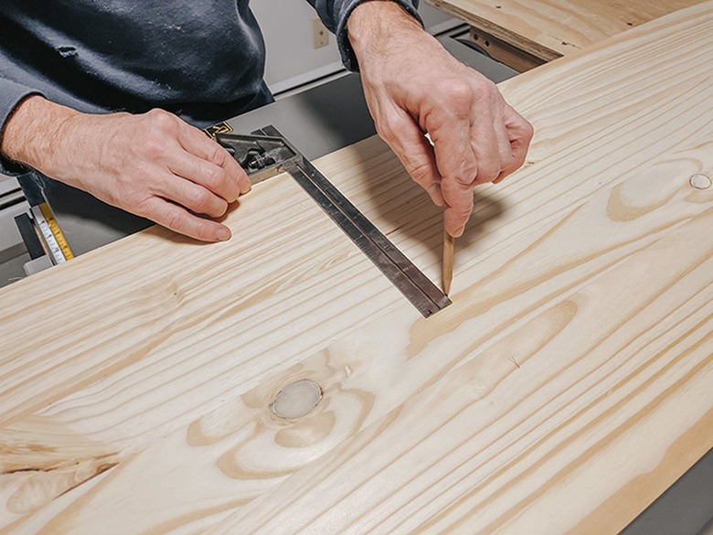 Measure and mark the wood panel.