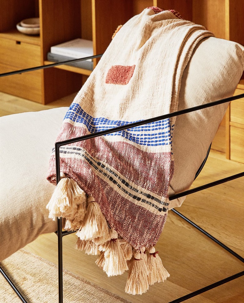 chair with throw blanket with tassels