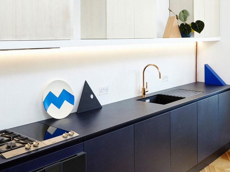 navy cabinets with navy paper composite counter