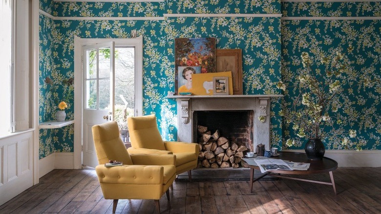 tropical inspired living room with blue and green wallpaper