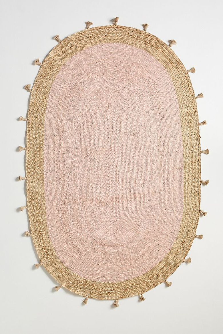 blush room decor with pom pom tassel rug by Anthropologie