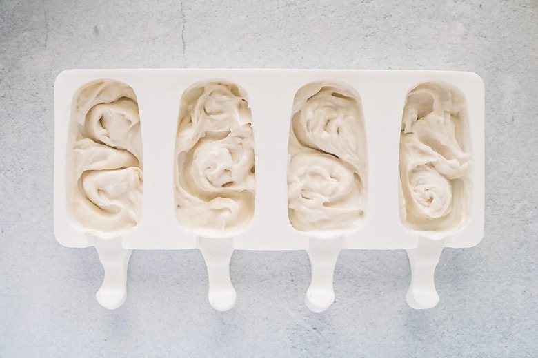 Add coconut ice cream to the molds