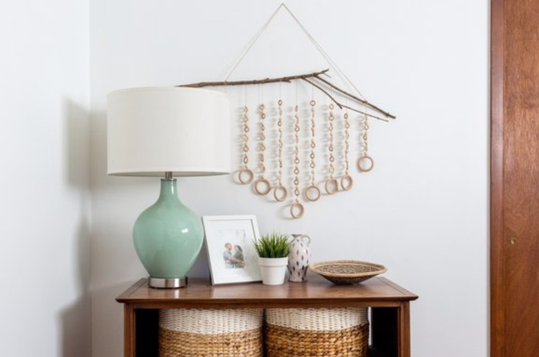 Mix and match pieces of wood to create this eclectic wall piece.