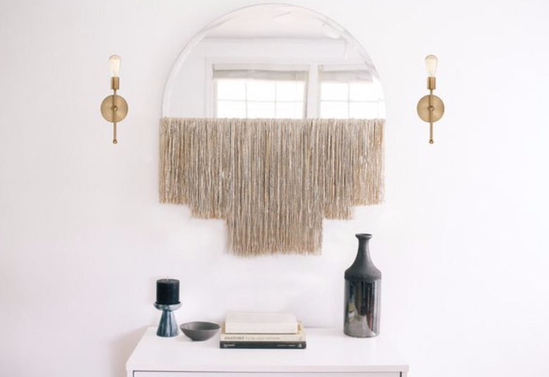 Make a mirror fancy with some fringe.