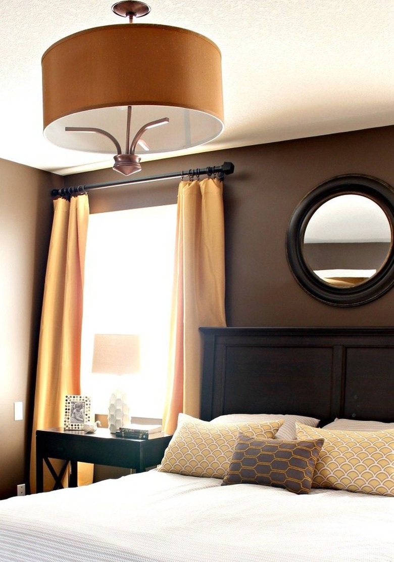 brown bedroom with yellow curtains