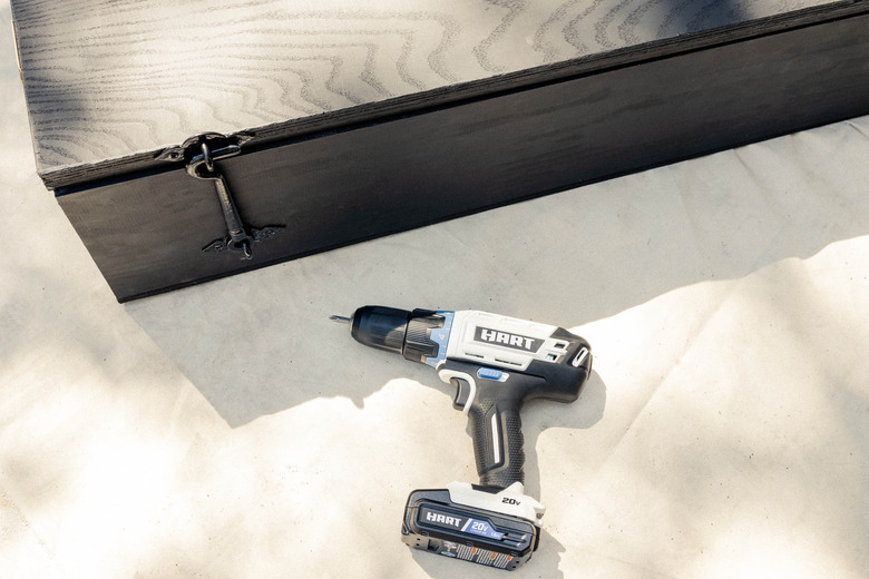 Gate latch hook and eye attached to side of cabinet with HART drill