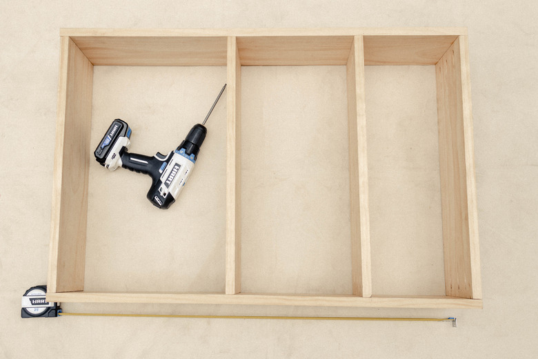 Two shelves attached to cabinet frame with HART drill