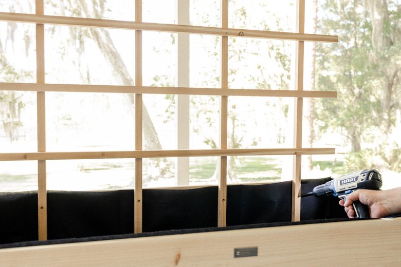 Attaching trellis to planter box with HART power drill