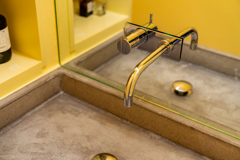 concrete trough sink in bathroom