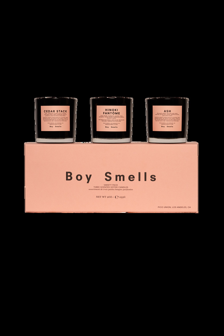 boy smells candle trio