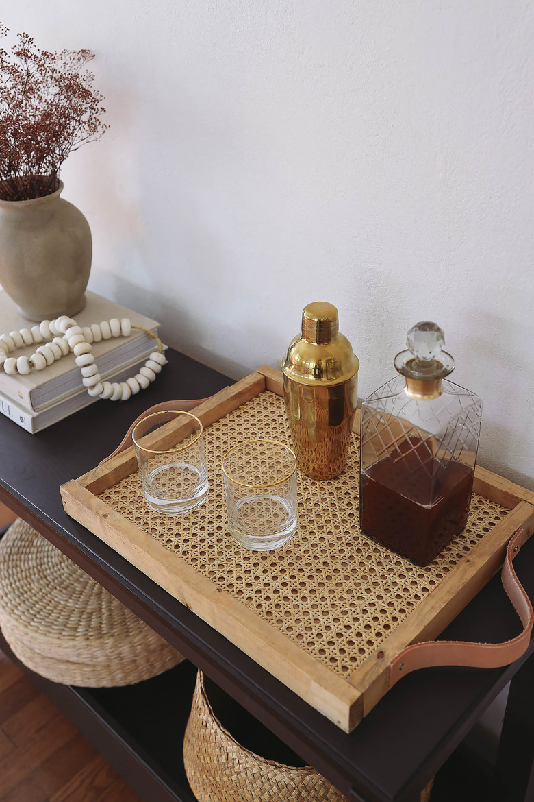 DIY cane webbing tray on table with cocktail shaker