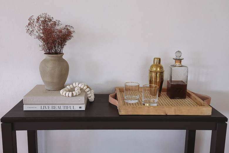 DIY cane webbing tray on table with cocktail shaker