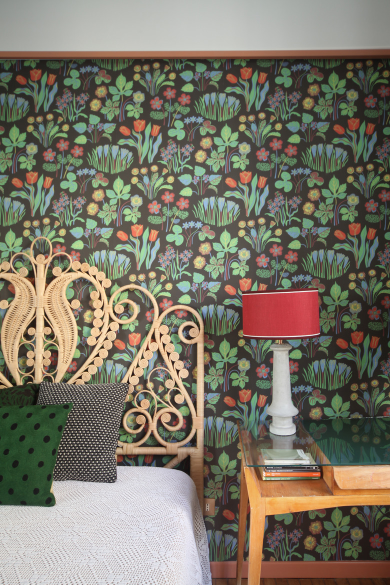 bedroom floral wallpaper with wicker bed