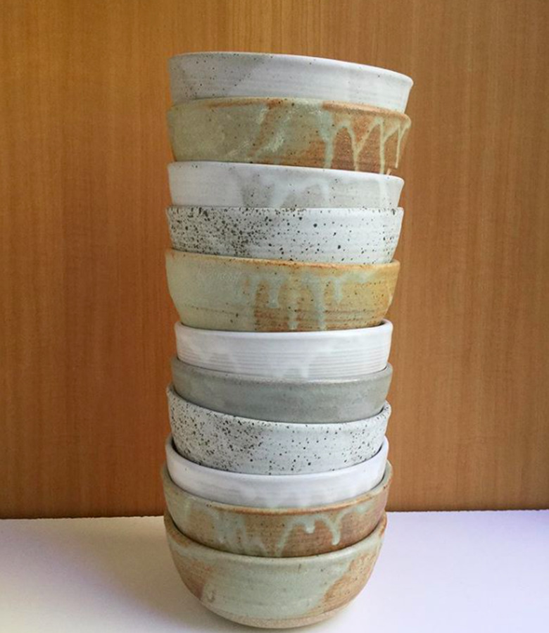 Stacked ceramic bowls of various colors