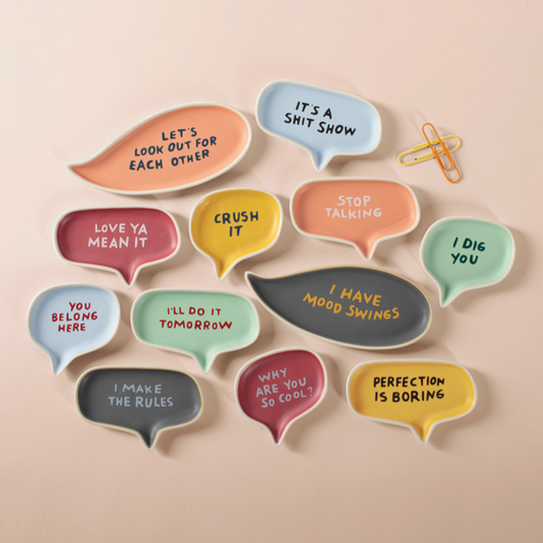 Small trays of different sizes and colors with messages