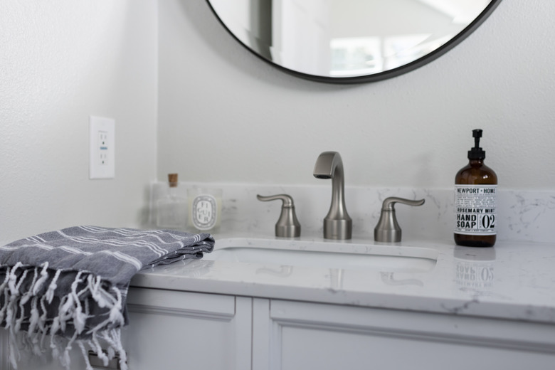 bathroom vanity with light grey cabinets