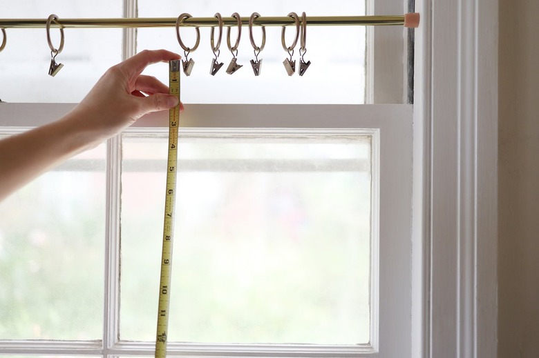 Measuring height of window with tape measure