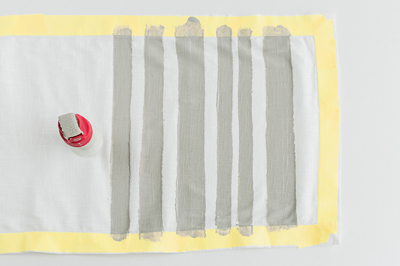 Roll painted stripes onto the runner.