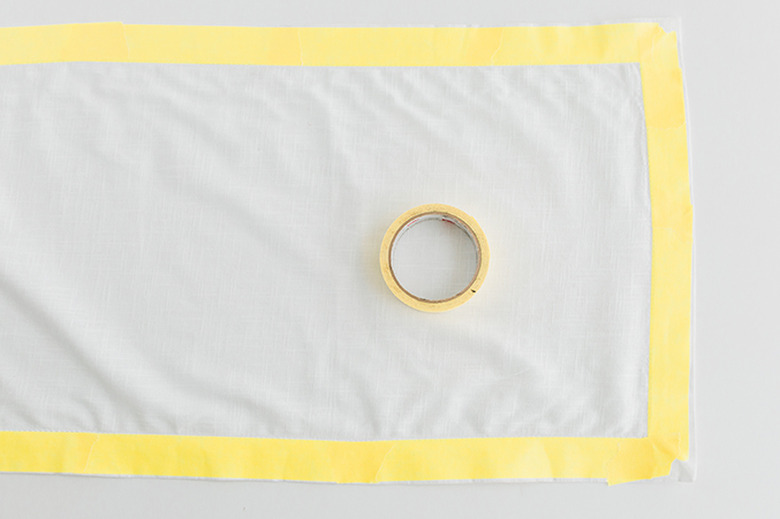 Mask off the edges of the runner using tape.