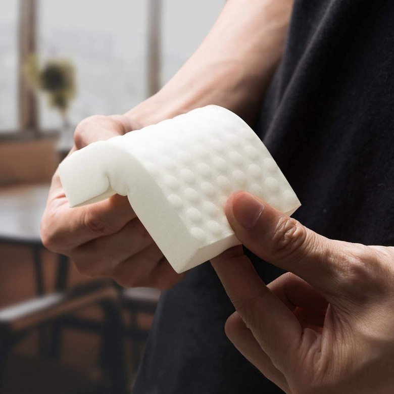 melamine cleaning sponge in hands