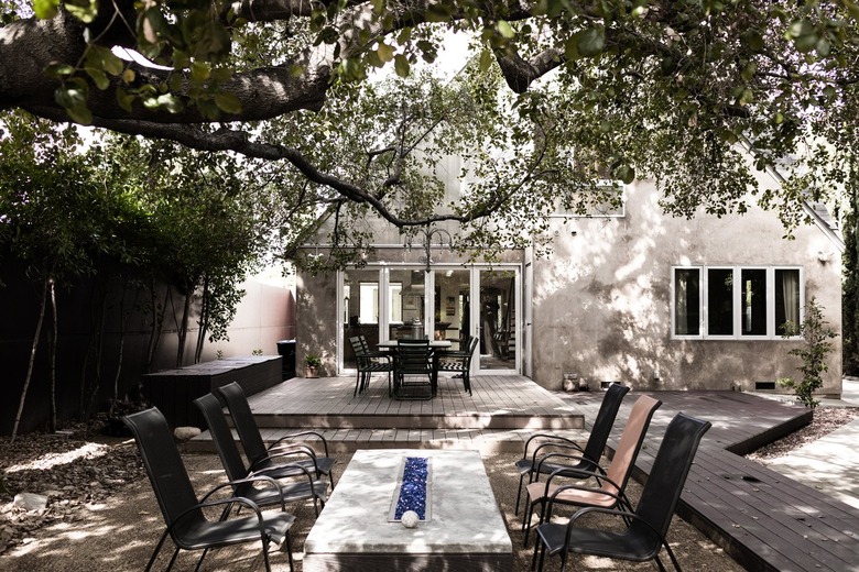 Outdoor fire table with chairs surrounding