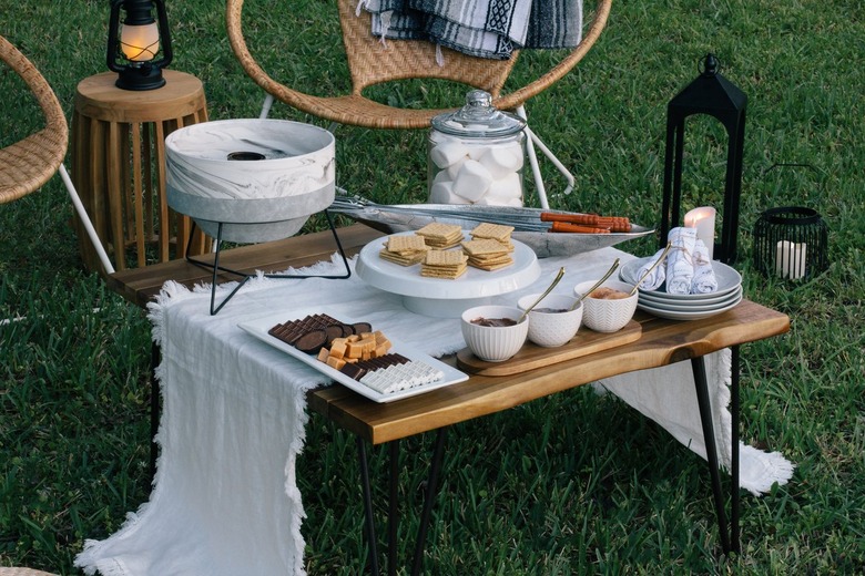 Outdoor s'mores spread with a small fire pit