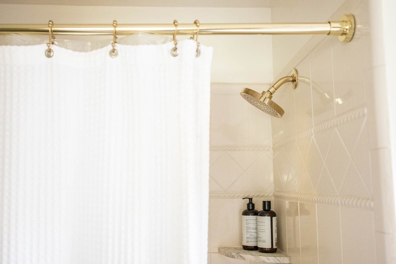 Shower with a gold rod