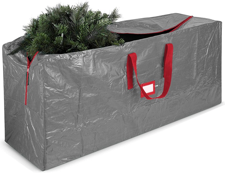Gray Christmas tree storage bag with red handles and label