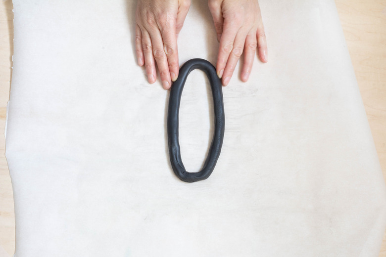 Forming clay into oval