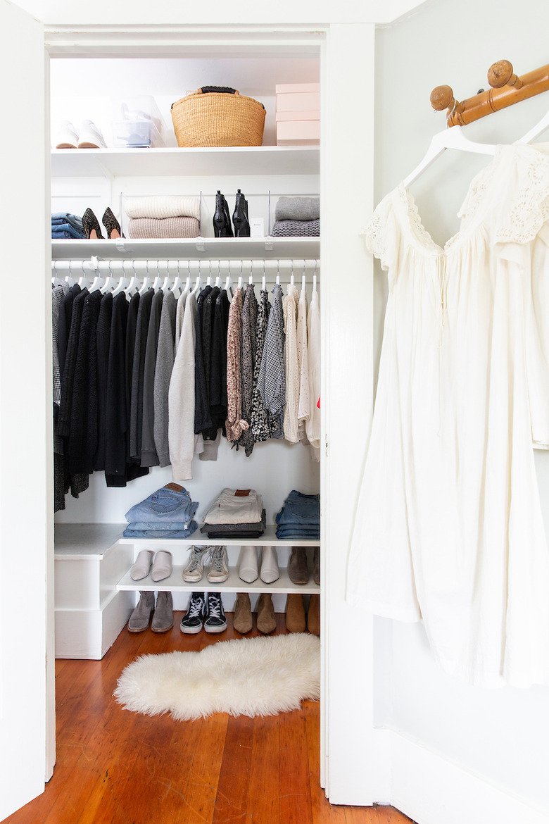 master bedroom closet storage idea with shelving and hanging rod and shoe rack
