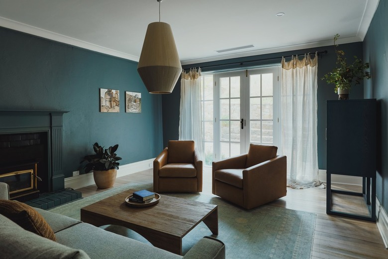 teal living room with fireplace