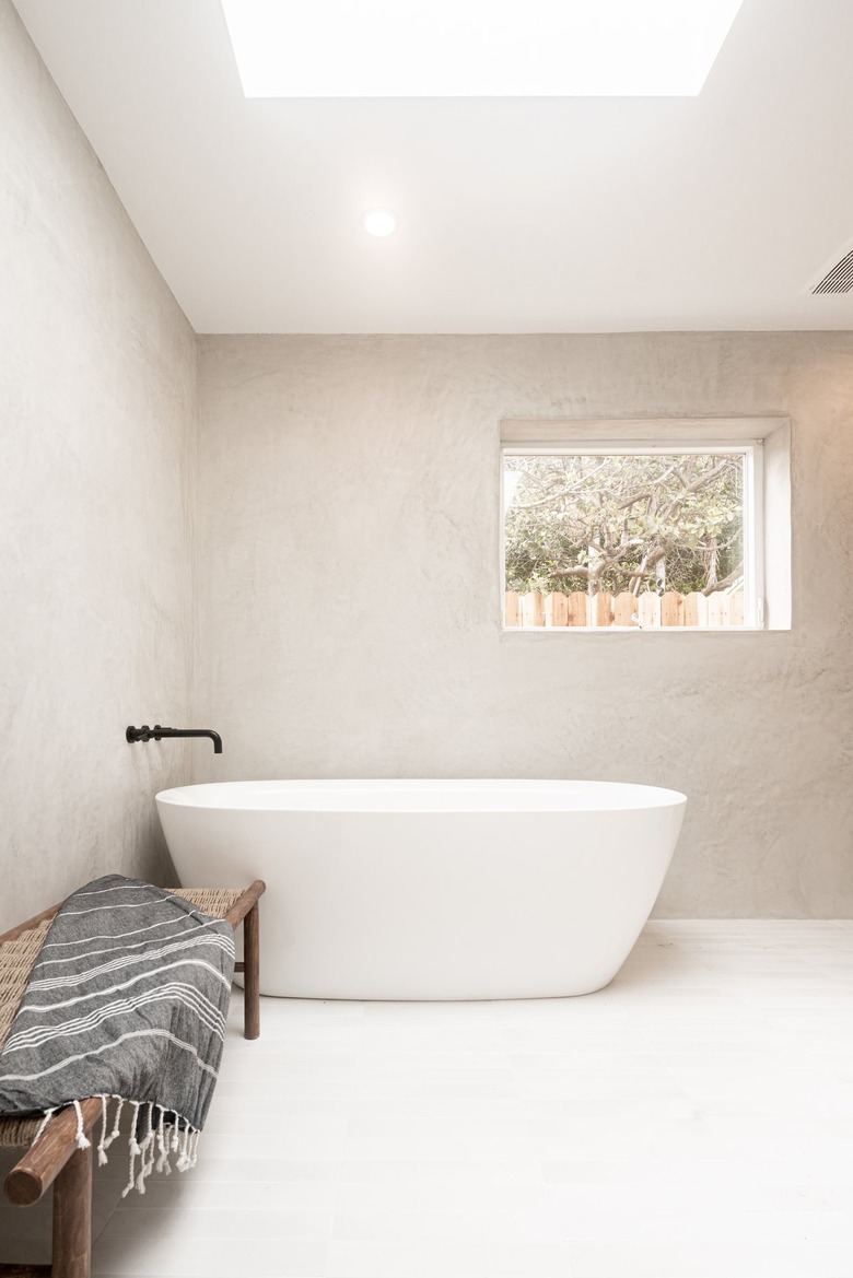 Minimalist bathroom with light gray walls