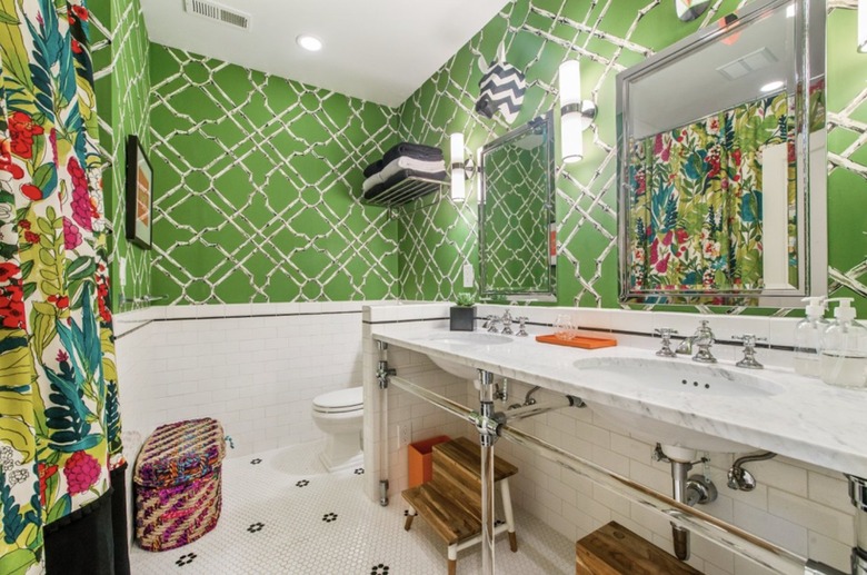 Vibrant coastal bathroom with green wallpaper