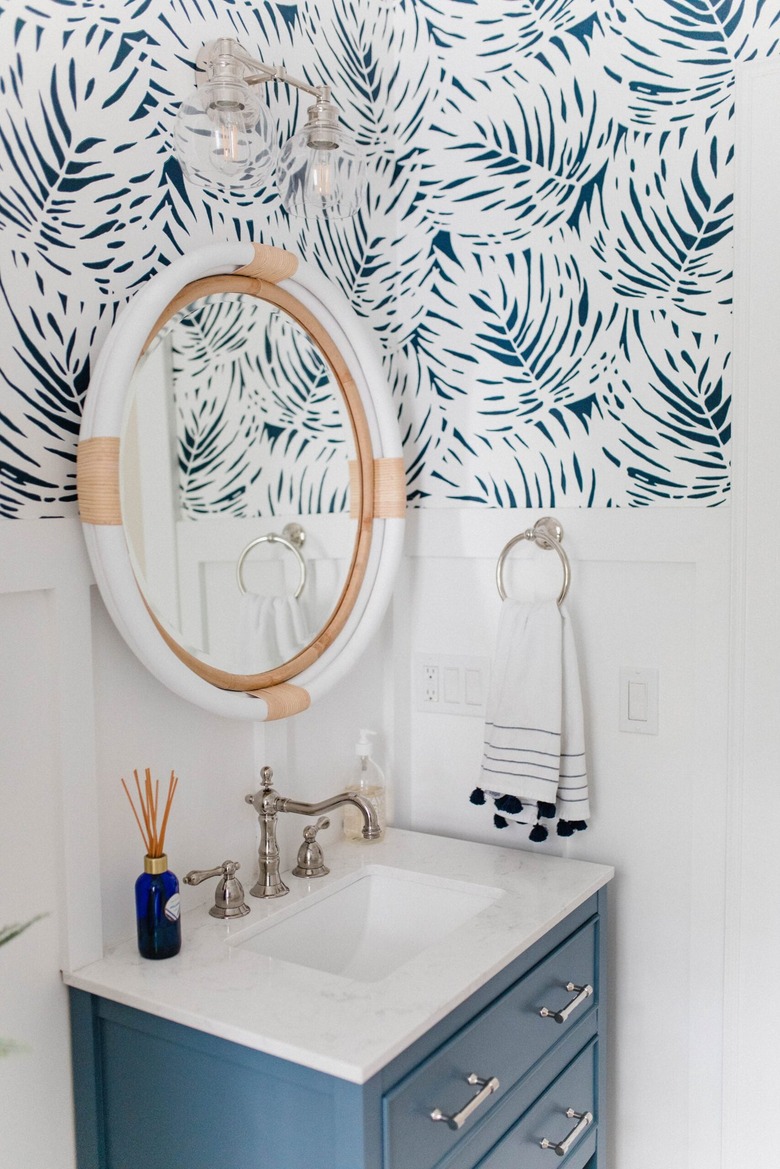 Nautical bathroom with beach wallpaper