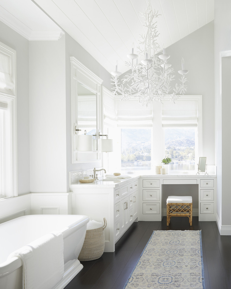 White coral coastal bathroom lighting idea in all-white bathroom