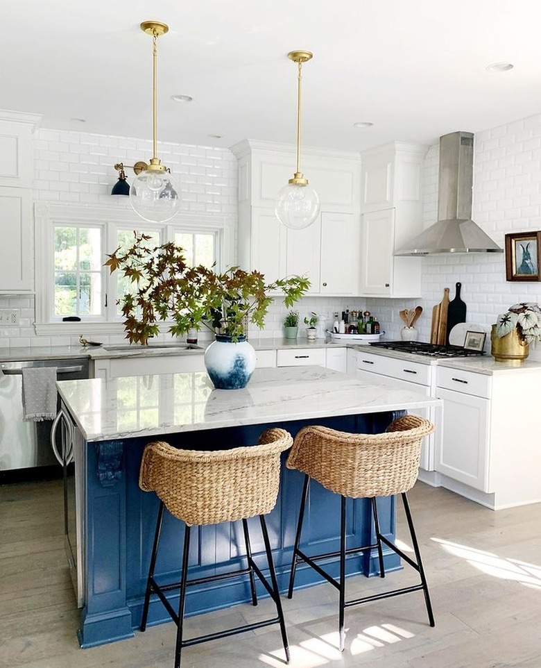 white kitchen with blue island