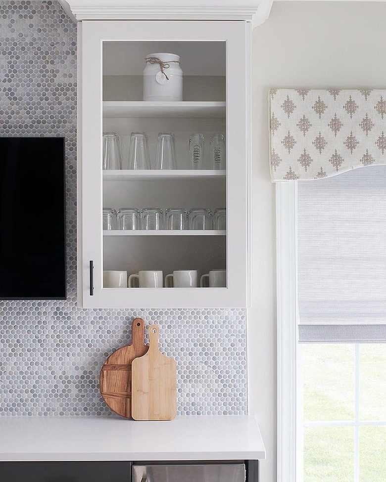 white kitchen with blue tile backsplash