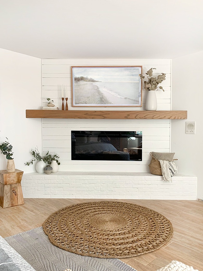 simple living room with white brick fireplace