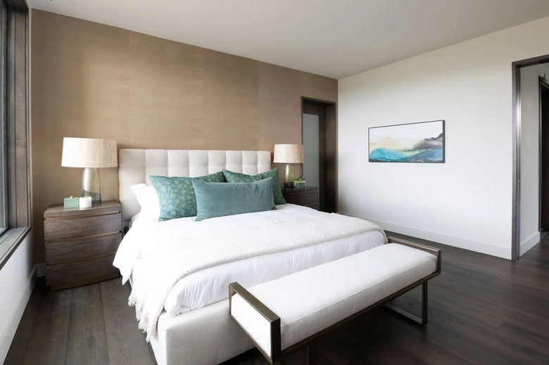 bedroom with champagne wall and lamps