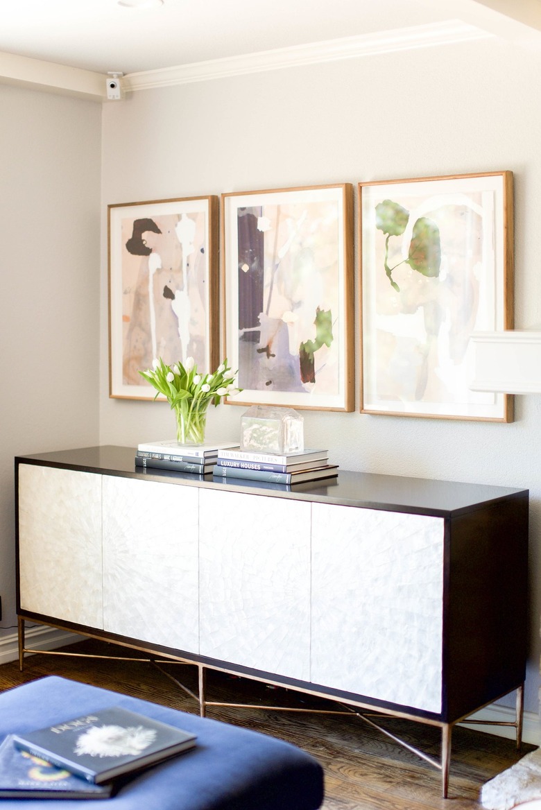 room with champagne wall and art